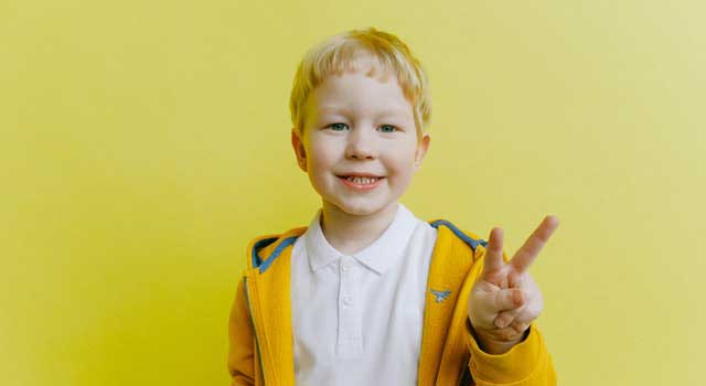 boy in yellow zip up jacket 3771646